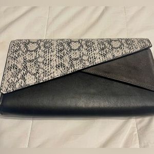 Black, gray, and faux snakeskin Vince Camuto clutch